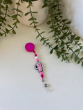 Pink cup badge reel