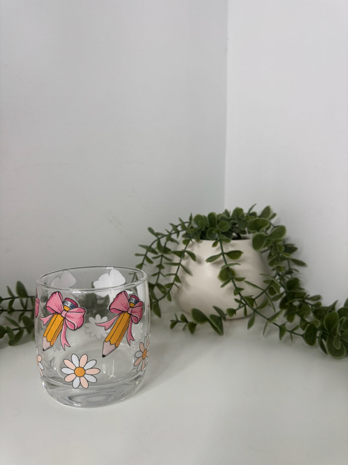Bow pencils whiskey glass
