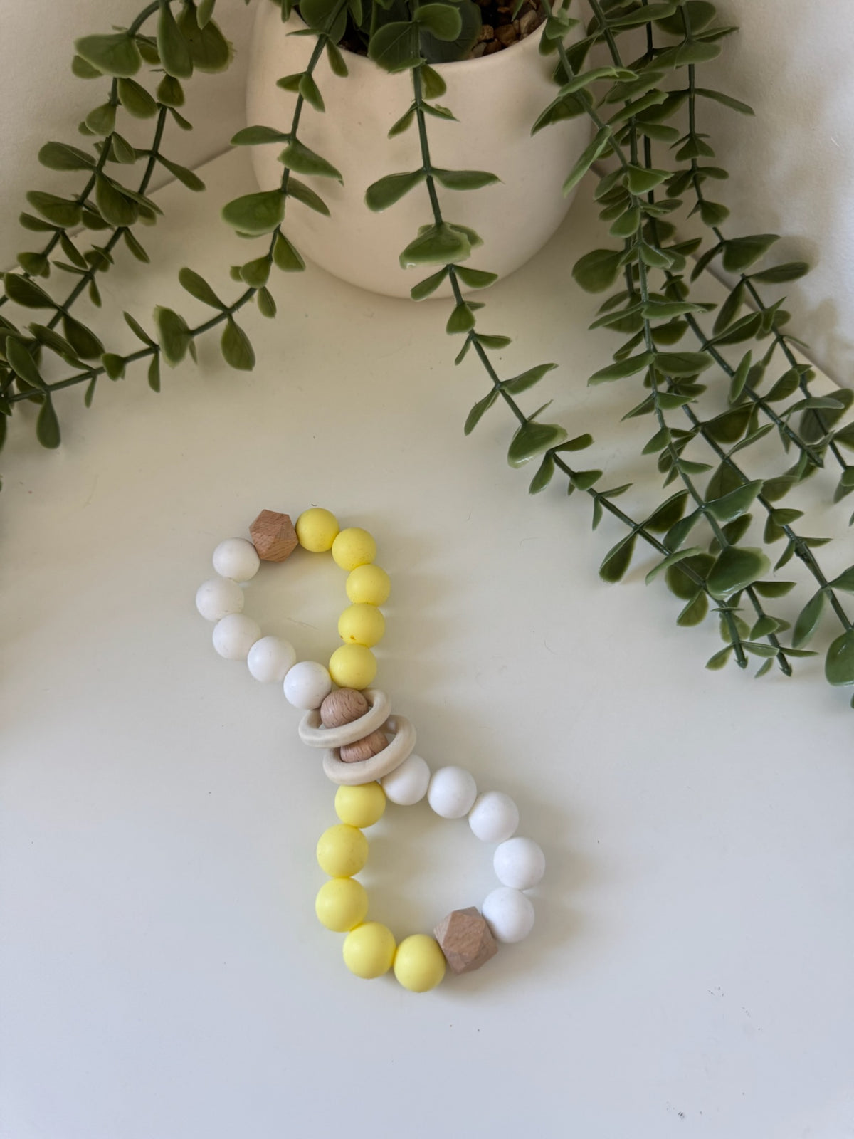 Yellow wooden bubble teether