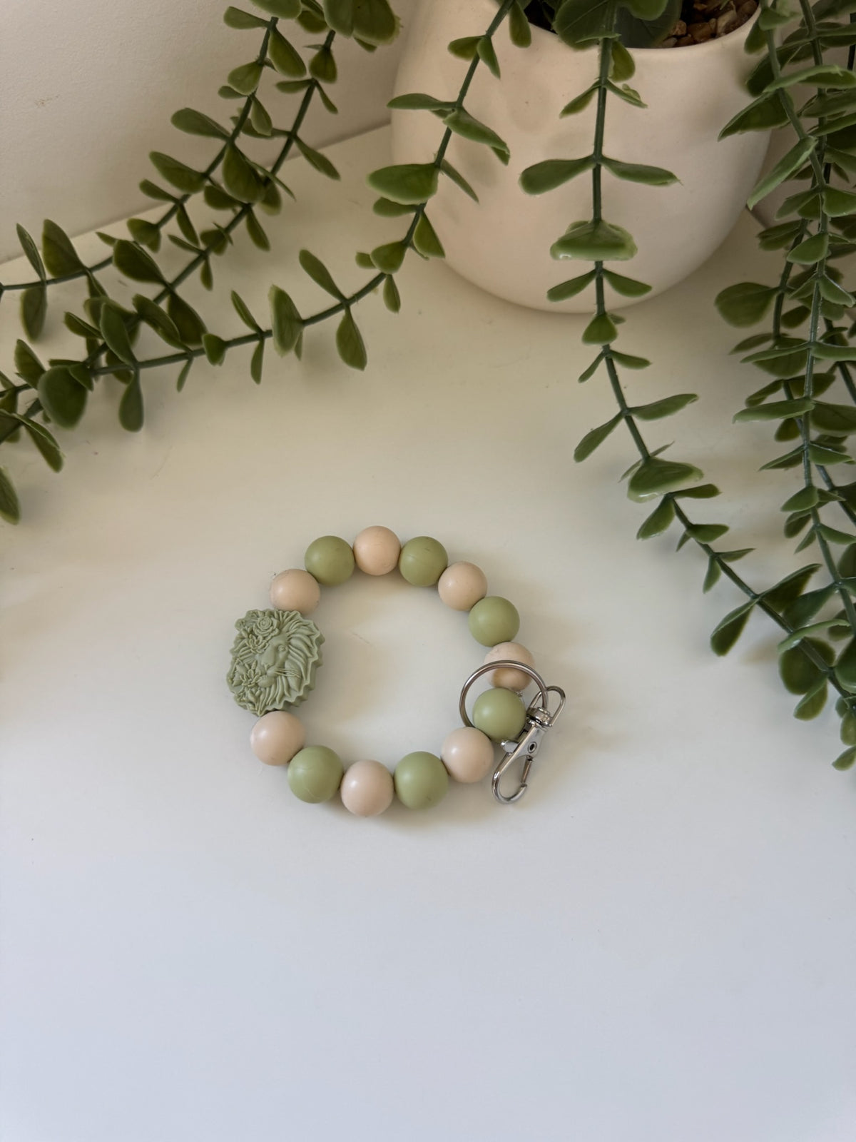 Sage lion head wristlet