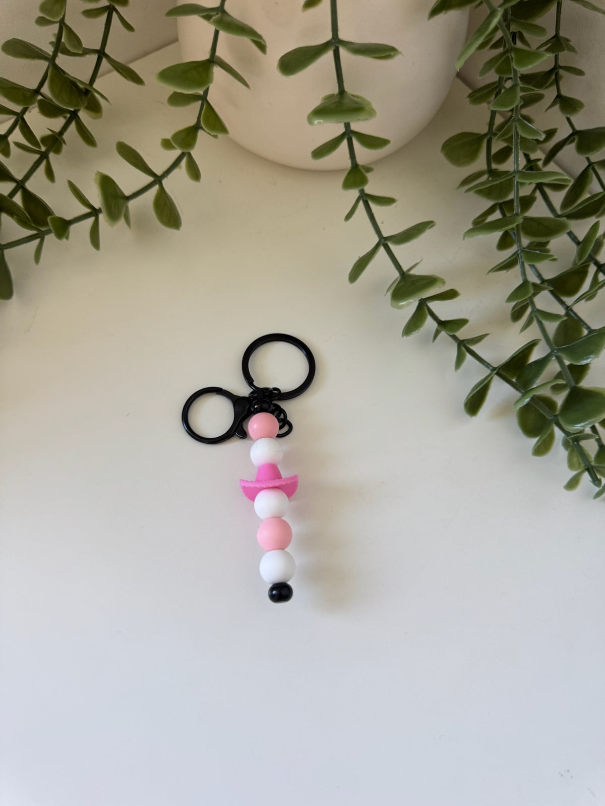 Pink cowboy hat metal keychain