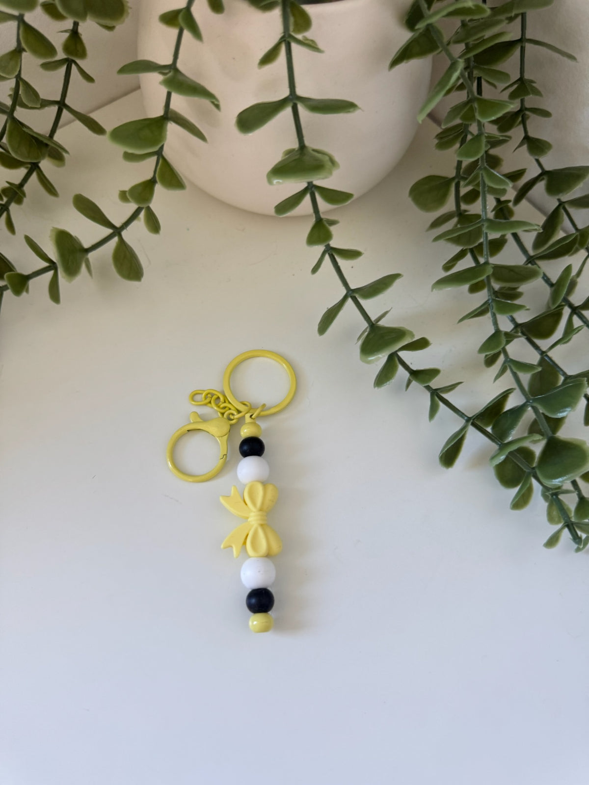 Yellow bow metal keychain