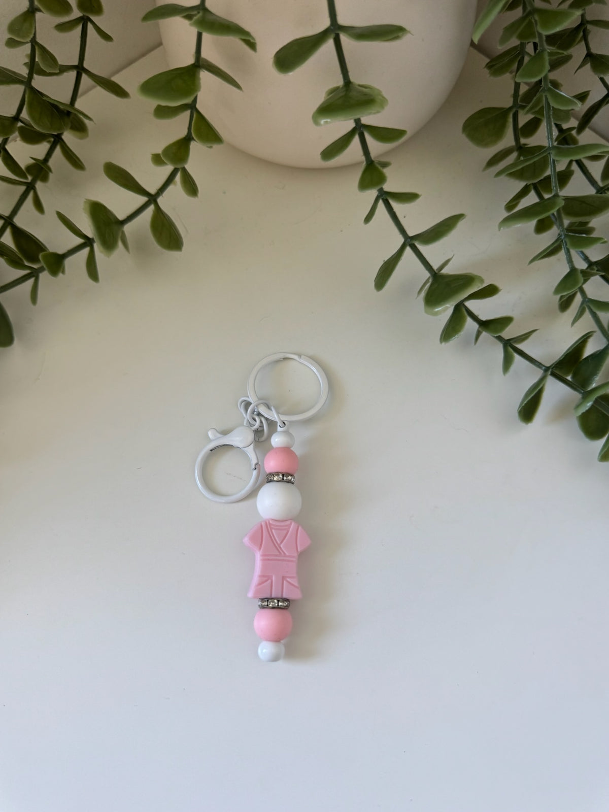 Pink scrub shirt metal keychain