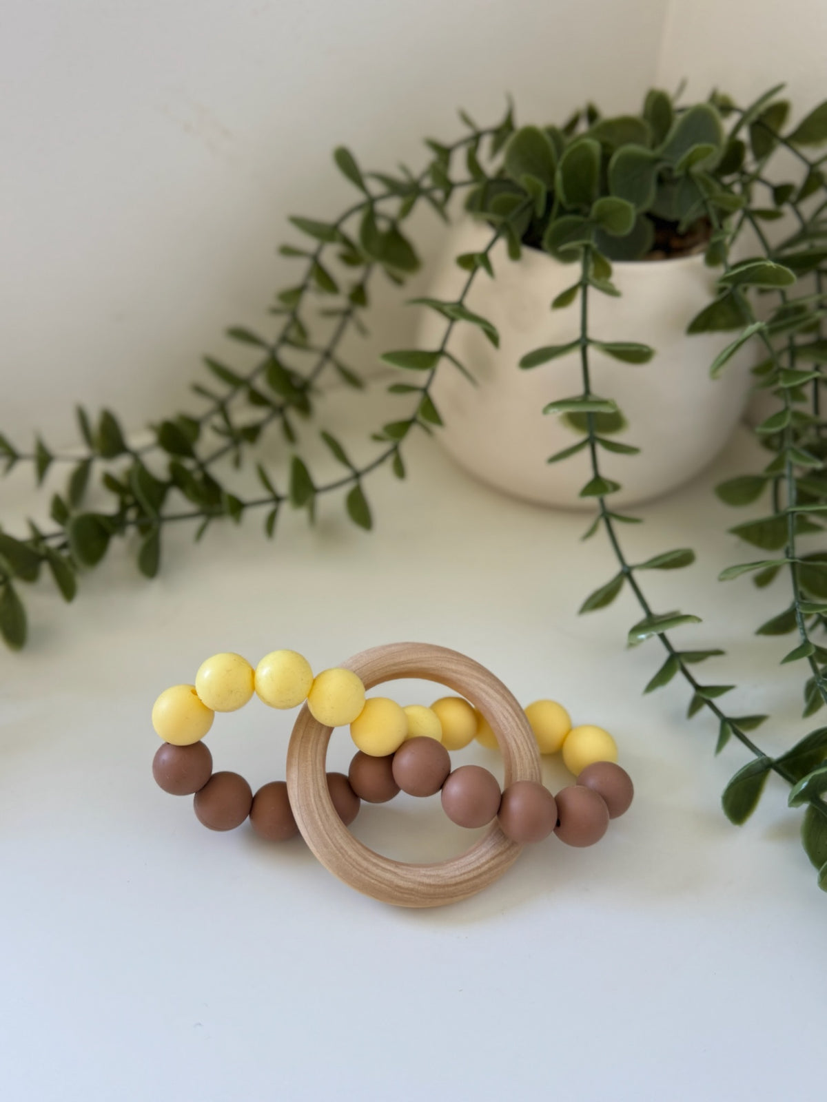 Yellow and brown infinity teether