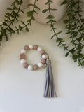 Brown arch wristlet