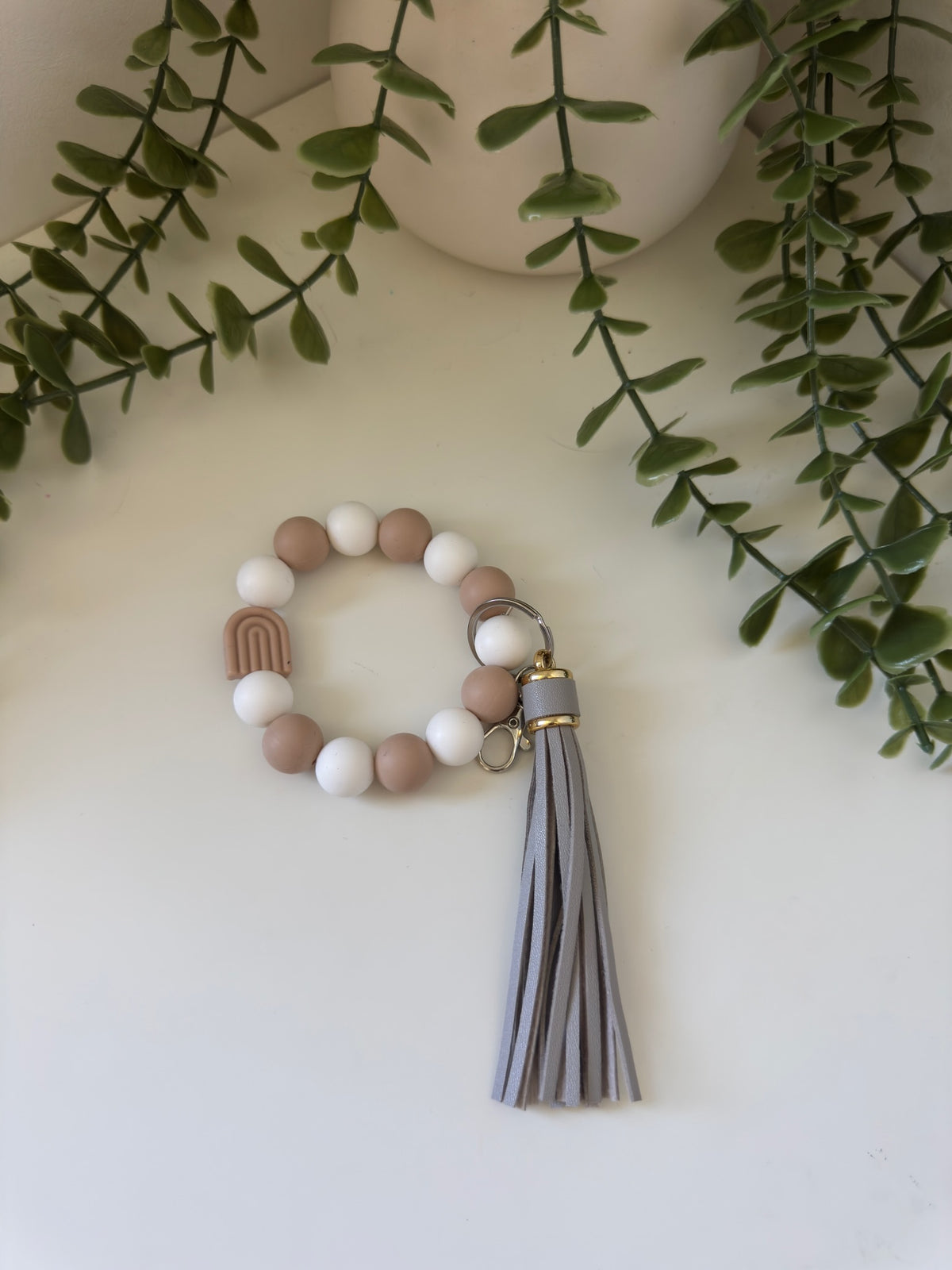 Brown arch wristlet