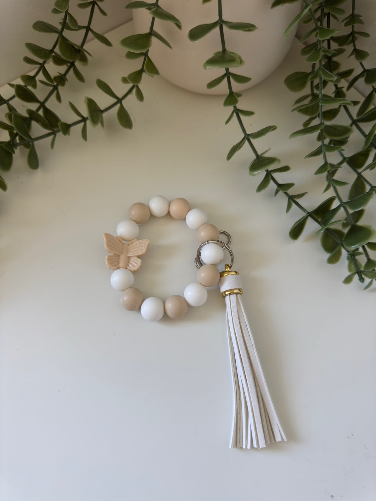Beige butterfly wristlet
