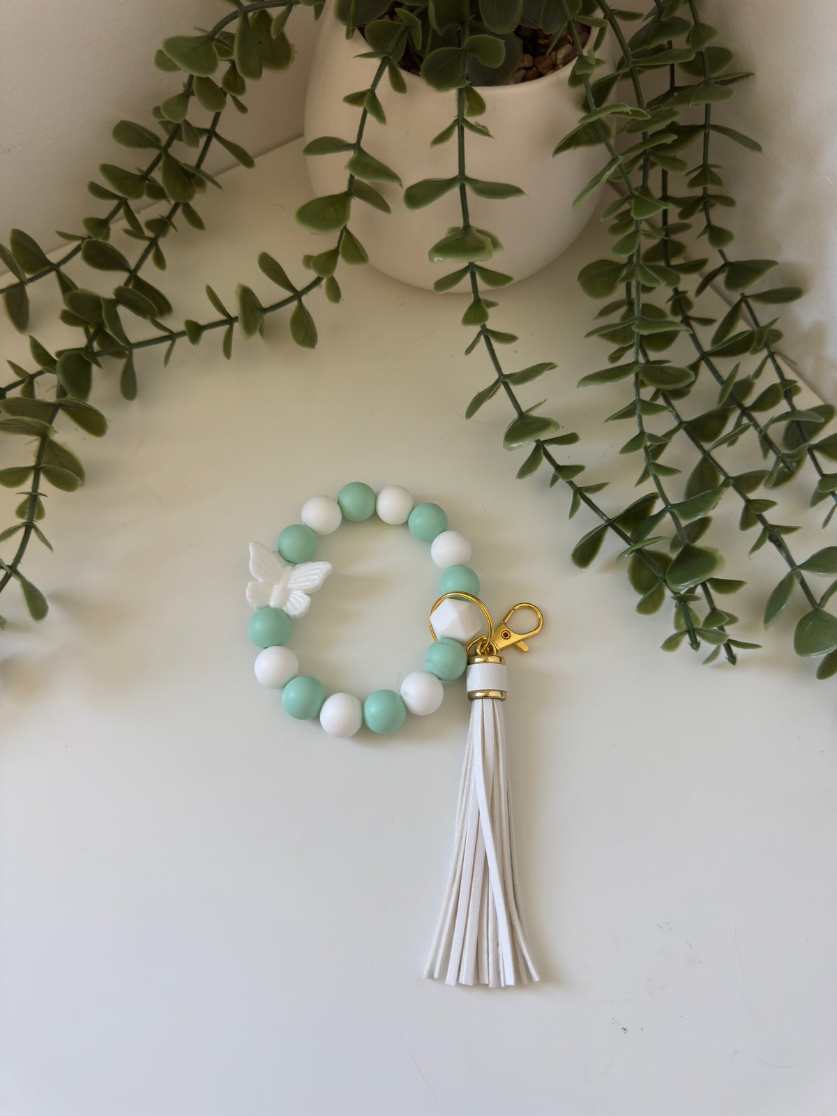 White butterfly wristlet