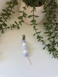 Blue cow print string keychain