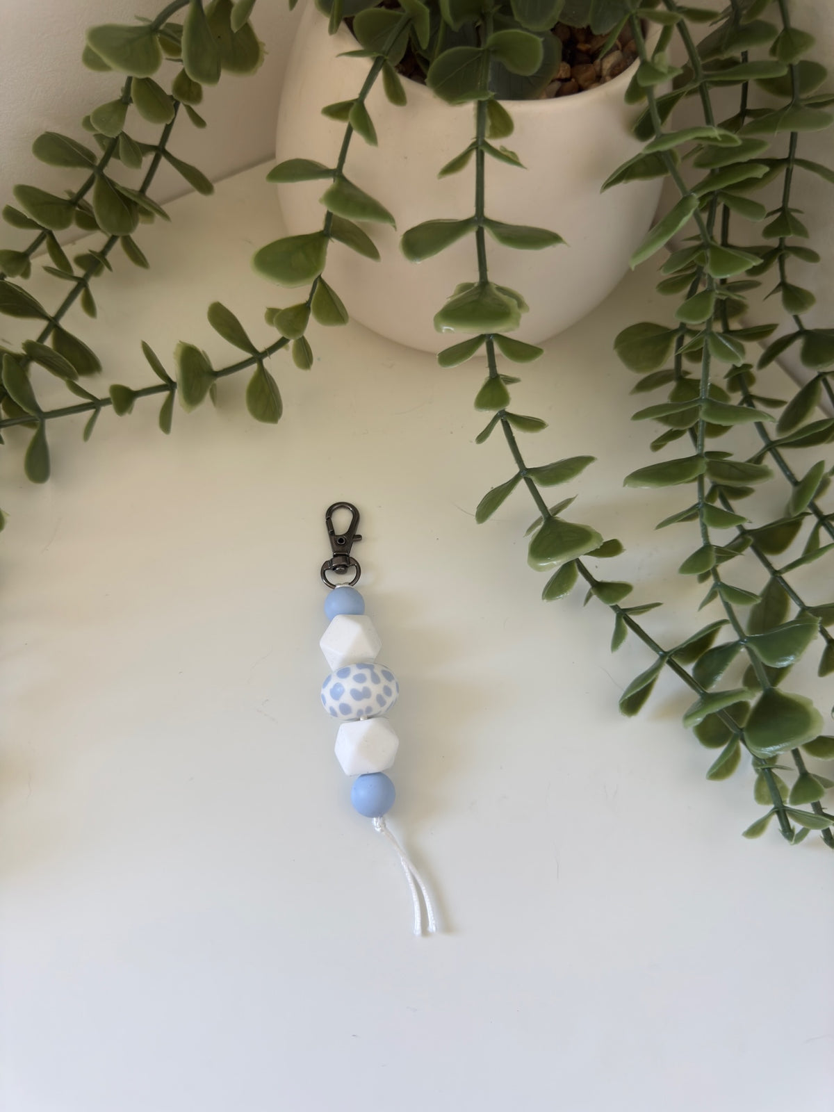 Blue cow print string keychain