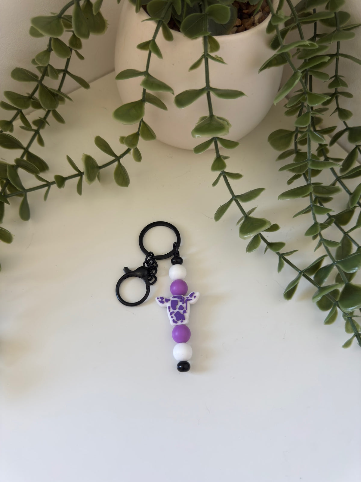 Purple cow head metal keychain