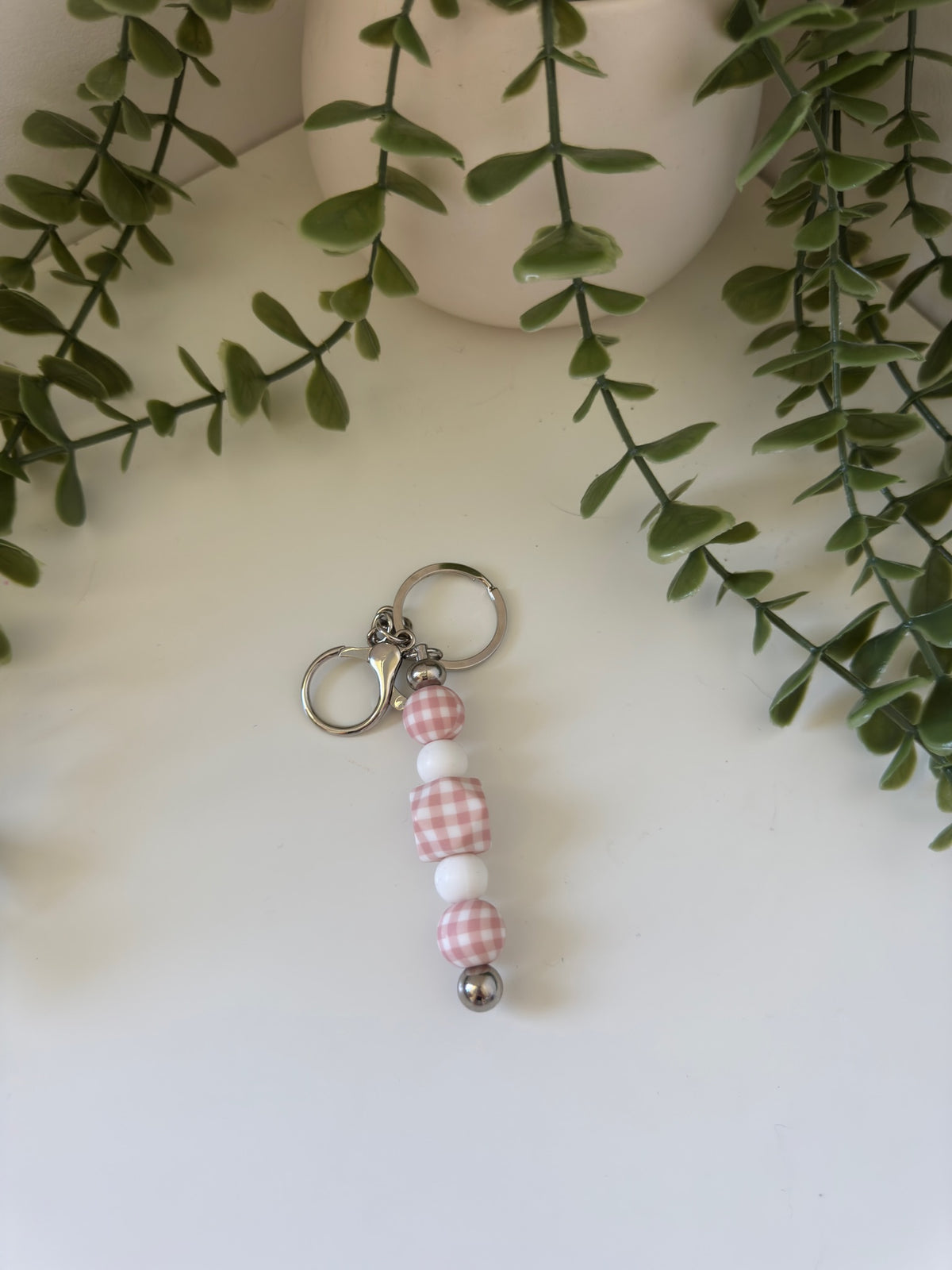 Pink gingham metal keychain