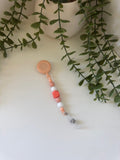 Peach badge reel