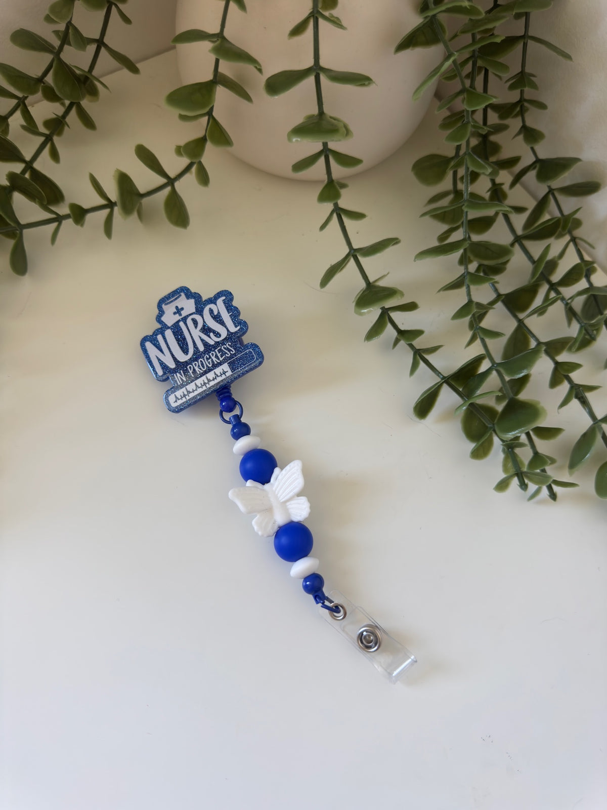 Blue nurse in progress badge reel