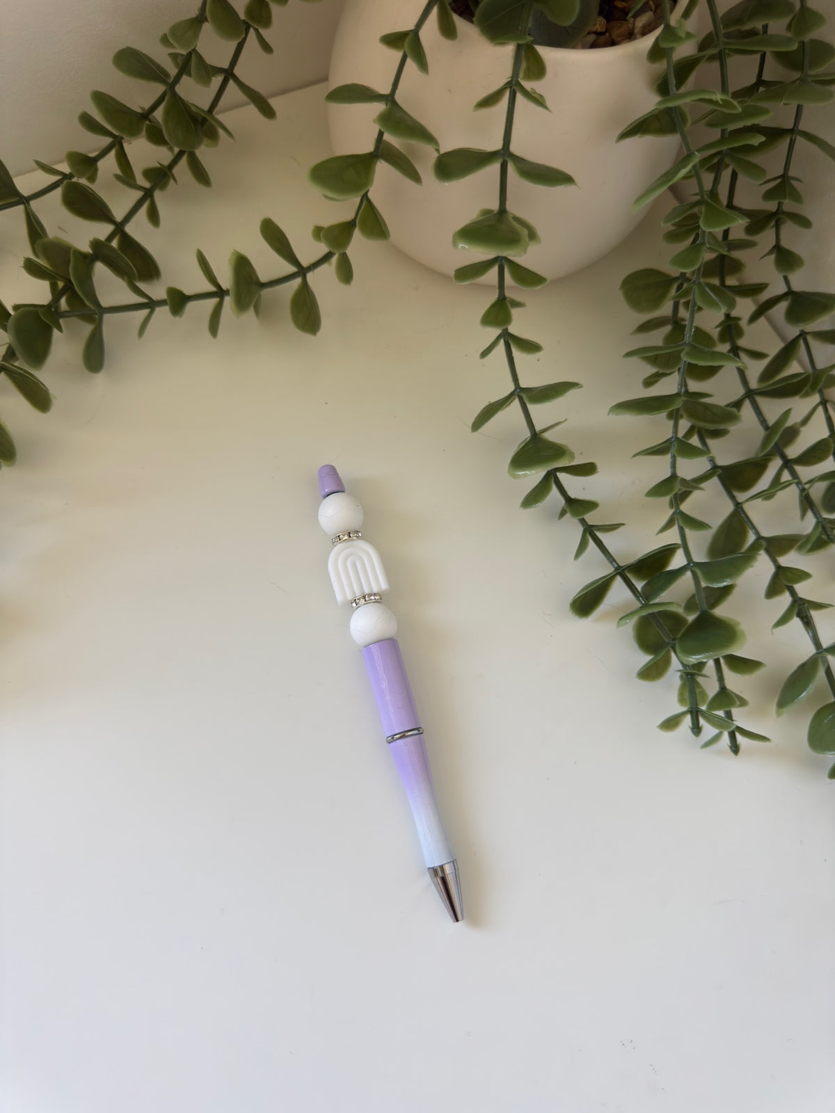 Purple and white arch pen