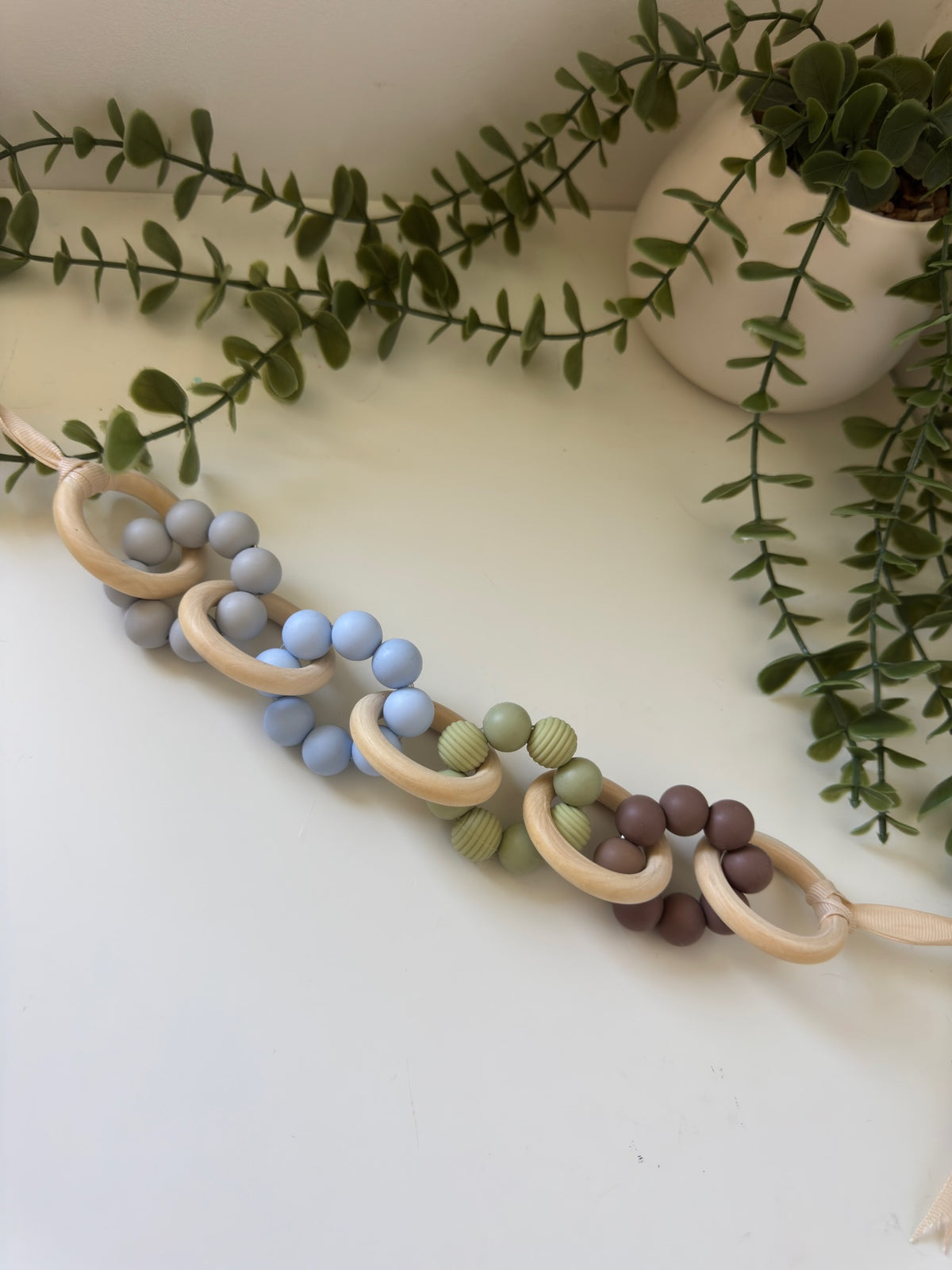 Blue and green pram garland